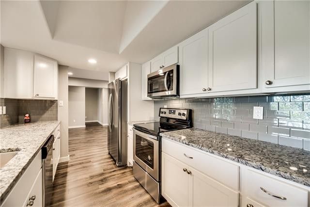 redesigned kitchen with marble countertop