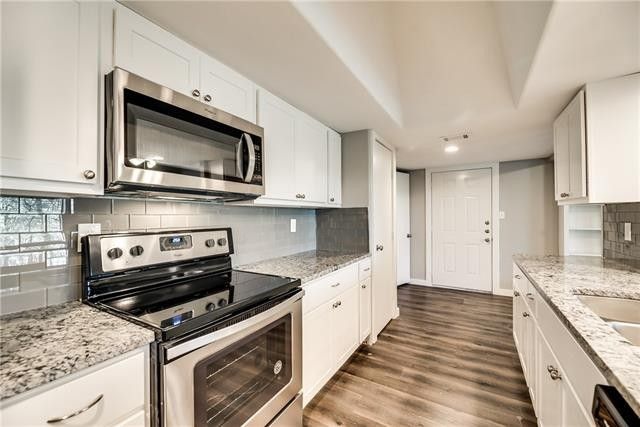Kitchen with white and black marble countertop