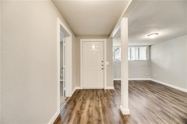 room with a dark wooden floor